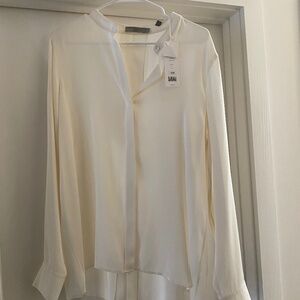 Creamy white colored Silk blouse with peekaboo back